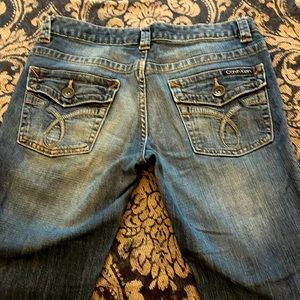 Calvin Klein distressed denim jeans, size 6,lean bootcut, excellent condition.